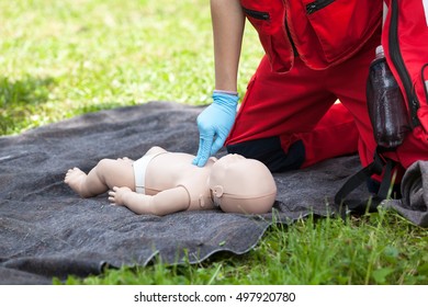 Baby CPR Dummy First Aid Training. Cardiopulmonary Resuscitation. Cardiac Massage.