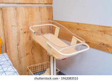 Baby Cradle In The Maternity Hospital. Postpartum Ward In The Clinic. Empty Bed For A Newborn. Closeup.