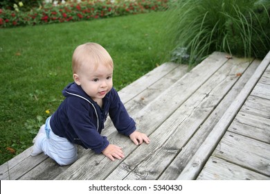 Baby Is Crawling And Climbing The Stairs Outside