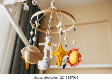 baby crib mobile handmade in the form of space astronaut planets. Plastic free toys. Natural organic toys. Eco-friendly.