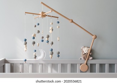 Baby Crib Mobile With Stars, Planets And Moon. Kids Handmade Toys Above The Newborn Crib. First Baby Eco-friendly Toys Made From Felt And Wood On Gray Background