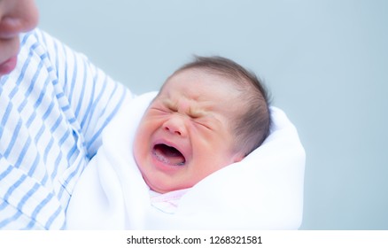 Baby Crying,Crying Innocent Baby,Asian Cute Baby Girl Hugging Her Mother Crying,Portrait Of A Loving Mother Holding Baby And Talking To Calm,Newborn Baby Girl Crying Portrait,Body Language Is Natural,