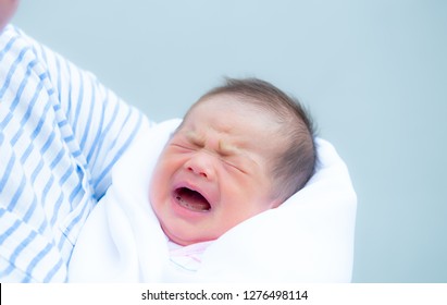 Baby Crying,Crying Innocent Baby,Asian Cute Baby Girl Hugging Her Mother Crying,Portrait Of A Loving Mother Holding Baby And Talking To Calm,Newborn Baby Girl Crying Portrait,Body Language Is Natural,