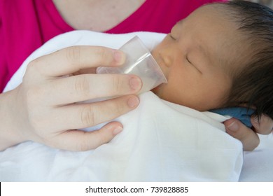 baby cup feeding for newborn. useful when small volumes of breastmilk/colostrum are being given and during emergency situations or mother has problem with her nipple.