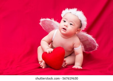 Baby Cupid On Red Background