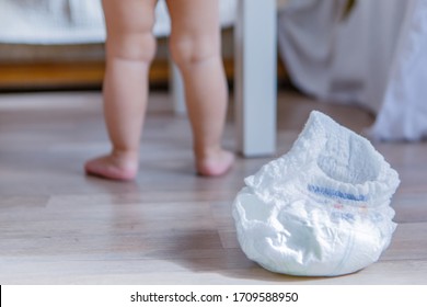 the baby and the diaper. The baby learned to walk on a potty. Used material. Concept of a healthy digestive system, helping parents, toilet training