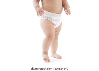 Baby In Diapers Walking On Floor, First Step