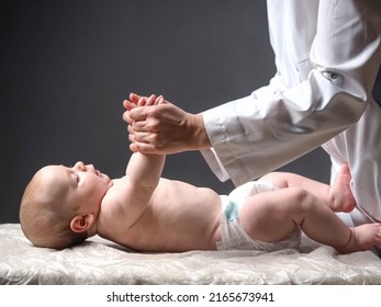 Baby And Doctor. Newborn Reflex Test