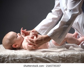 Baby And Doctor. Newborn Reflex Test