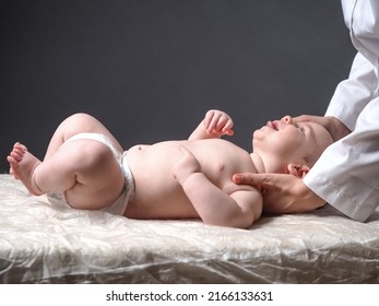 Baby And Doctor. Newborn Reflex Test