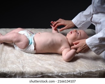 Baby And Doctor. Newborn Reflex Test