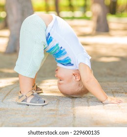 Baby Doing Yoga Exercises Downward Facing Dog Pose Adho Mukha Svanasana Baby Doing Yoga Exercises Downward Facing Dog Pose Adho Mukha Svanasana