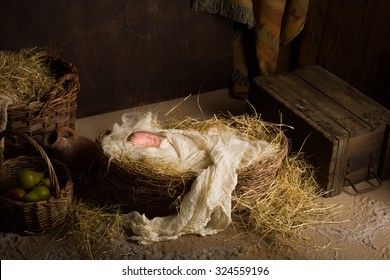 Baby doll acting as Jesus in a Christmas Nativity scene