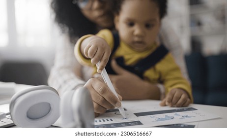 Baby drawing business papers