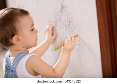 Baby Drawing On Wall.