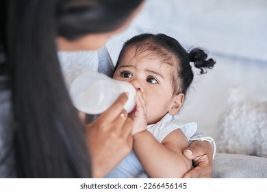 Baby drink bottle, formula and nutrition with feeding and family, healthy and growth with early childhood development. Mother feed infant child milk, people at home with health and wellness - Powered by Shutterstock