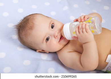 Baby  Drinking Milk From Bottle