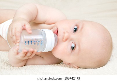 Baby Drinking Water From A Bottle