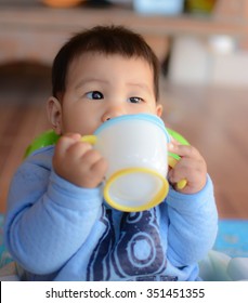 Baby Drinking Water From Cup, South East Asian Thai Baby Boy