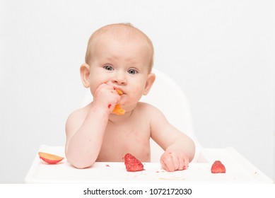 Baby At The Early Stages Of Baby Led Weaning