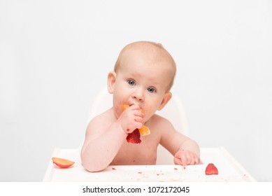 Baby At The Early Stages Of Baby Led Weaning