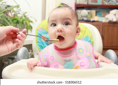 Baby Eating With Mother