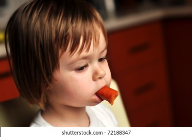 Baby Eating Sausage