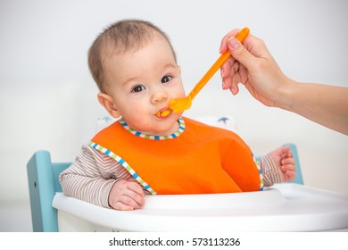 Baby Eating Solid Food. (6 Months Old)