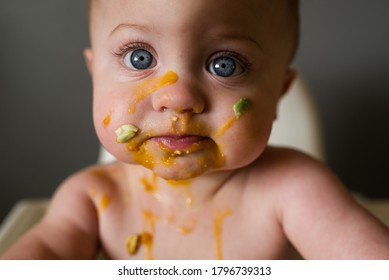 Baby Eating Solids With Food All Over His Face