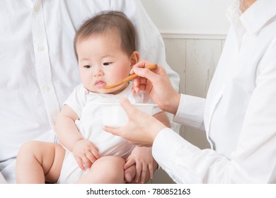 A baby eats a baby food
