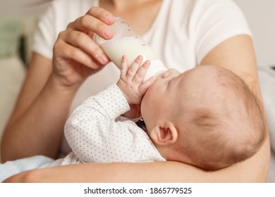 baby eats milk from a bottle - Powered by Shutterstock