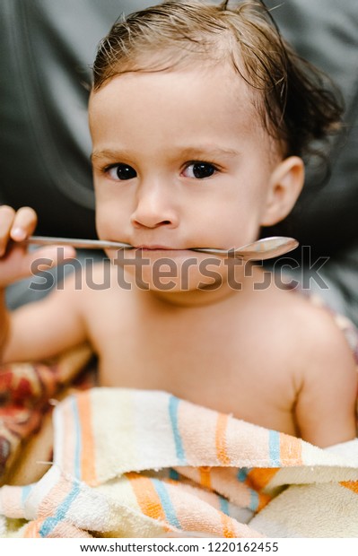 baby eating towel