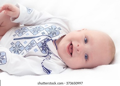 Baby In Embroidered Shirt