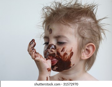 Baby With Face Covered In Chocolate