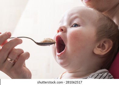 Baby Feeding Spoon Of Porridge