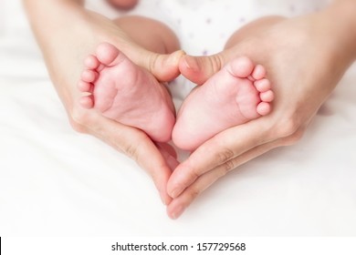 Baby Feet In Mother Hands