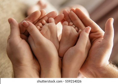 Baby Feet In Parent Hands