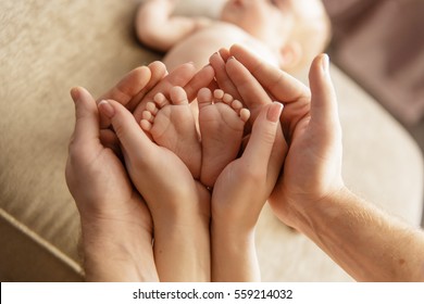 Baby feet in parent hands