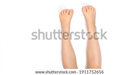 baby feet stick up on white background