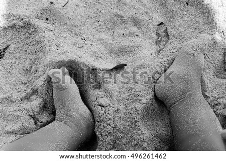 baby feets on beach sand