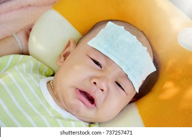 The Baby Is Feverish And Crying. Relieve Heat In Infants With Fever. Selective Focus.