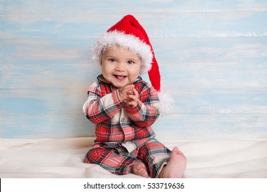 Baby First Christmas. Baby With Santa Hat. Santa Baby.