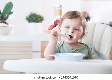 baby; food; toddler; infant; child; feed; spoon; healthy; kid; happy; porridge; little; meal; funny; hungry; newborn; care; diet; hand; nutrition; health; itself; sitting; cute; holding; yoghurt
