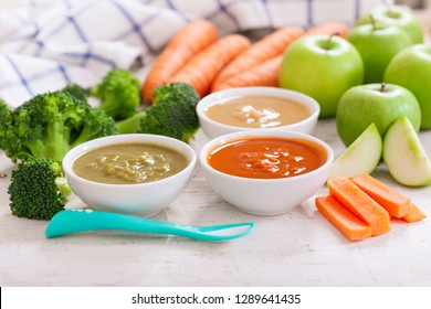 Baby Food. Various Bowls Of Fruit And Vegetable Puree With Ingredients For Cooking On Wooden Table