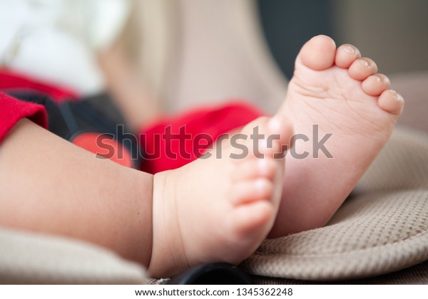 Baby Foot On Car\
Seat