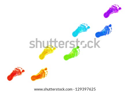 Baby foot prints all colors of the rainbow. The joyful journey. Isolated on white background
