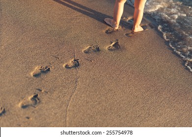 Baby Footprints In The Sand