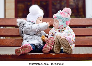 baby friends sitting on the bench