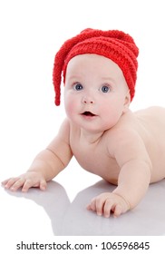 Baby In Funny Red Hat. Isolated On White Background