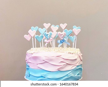 Baby Gender Revelation Cake With Pastel Colors And Little Hearts